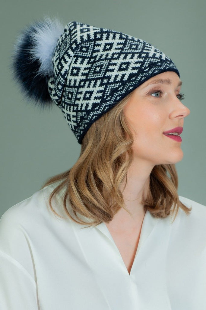 Knit Wool Beanie Hat With Fox Fur Pom-Pom in White Rhombus Pattern in Dark Blue Background